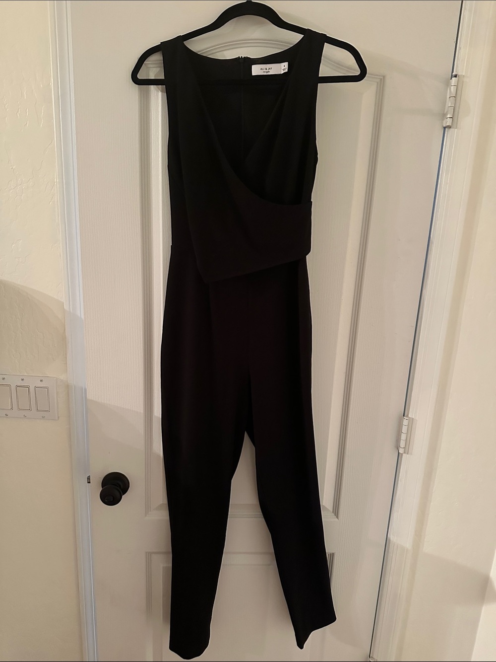 ALI & JAY Black Sleeveless Jumpsuit with Crossover Bodice